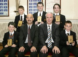 Mr. Raymond Cassidy, Guest Speaker congratulates the Year 8 Credit Union Quiz team. They won both the Newry Chapter Quiz competition and the Armagh/South Down Regional Final. Included are Connor Hogan, Cormac Linden, Daire McAteer, Christopher White and Keith Connolly.